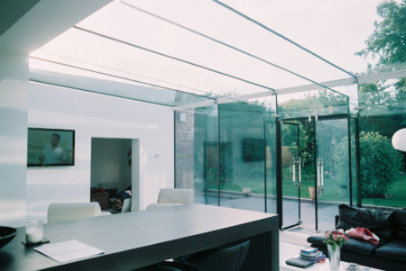 Frameless glass box incorporating ClearGlaze doors and blinds.