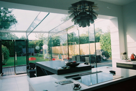 Frameless glass box incorporating ClearGlaze doors and blinds.