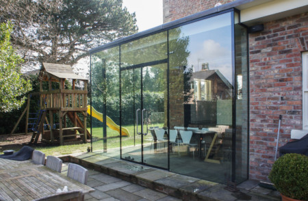 Structural glass floor to ceiling with ClearGlaze frameless glass doors.