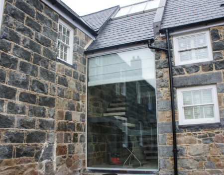 Structural glass link using frameless double glazed doors.
