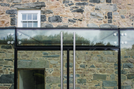 Structural glass link using frameless double glazed doors.