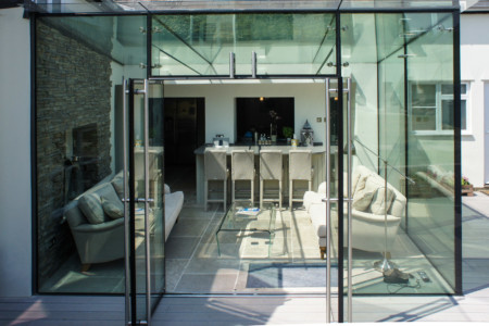 Structural glazing with frameless glass doors.