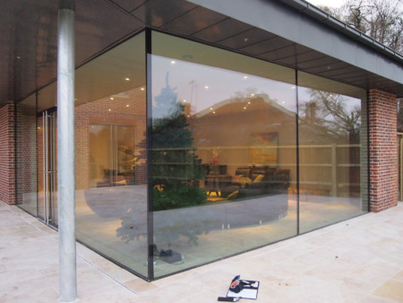 Oversized glass panels with ClearGlaze frameless glass doors.