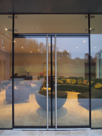 Oversized glass panels with ClearGlaze frameless glass doors.