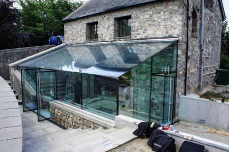 Fixed structural glass box using frameless double glazed doors.