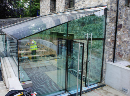 Fixed structural glass box using frameless double glazed doors.