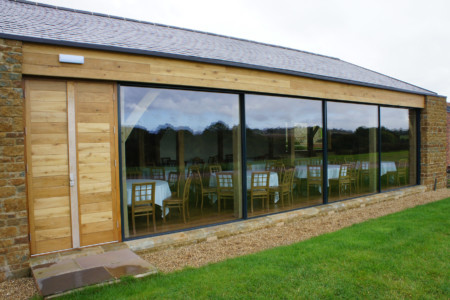Structural glazing with frameless glass doors and Sky-frame sliding doors.