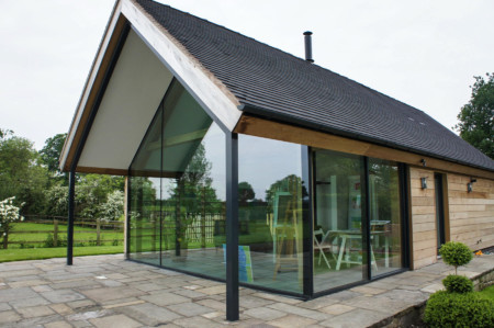 Frameless glass link to main house plus structural glazing and Sky-Frame 2 sliding doors
