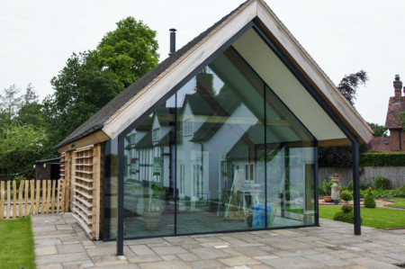 Frameless glass link to main house plus structural glazing and Sky-Frame 2 sliding doors