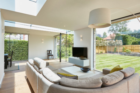 Sky-Frame sliding doors with structural glass panels fixed structural glass rooflights.